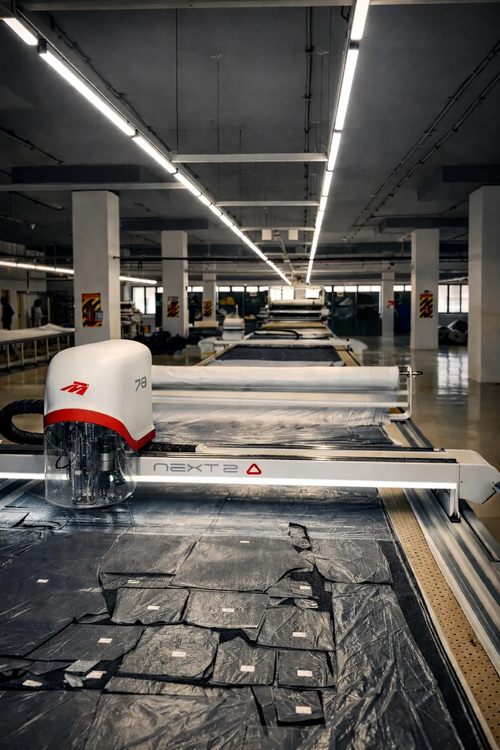 Morgan Tecnica NEXT 2 automated fabric cutting machine at Bluback Denim cutting department for precision denim pattern cutting